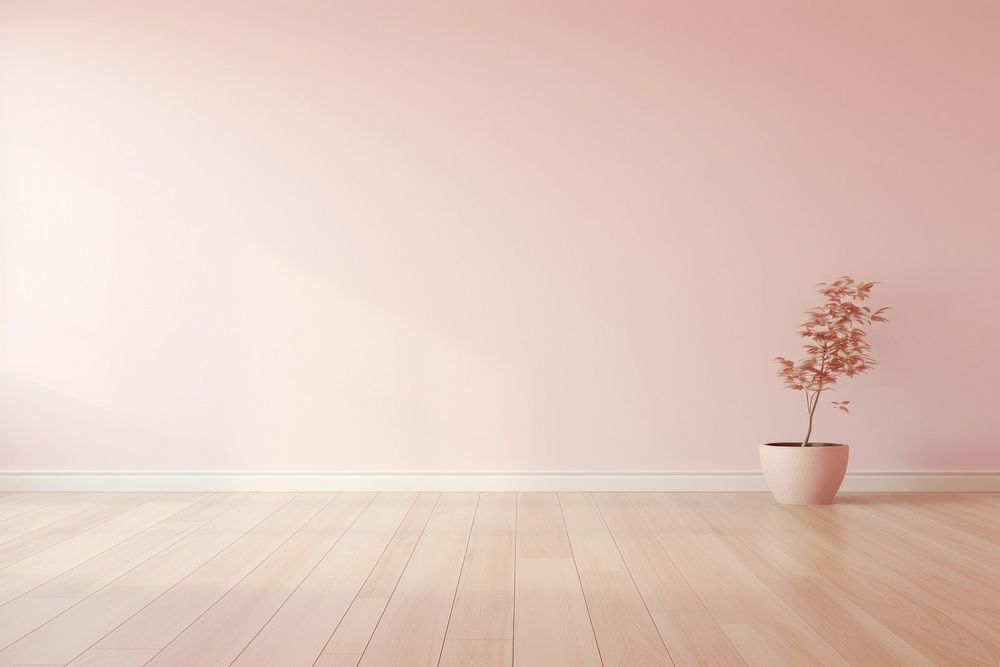Light pink wall in an empty room with a wooden floor architecture flooring hardwood.