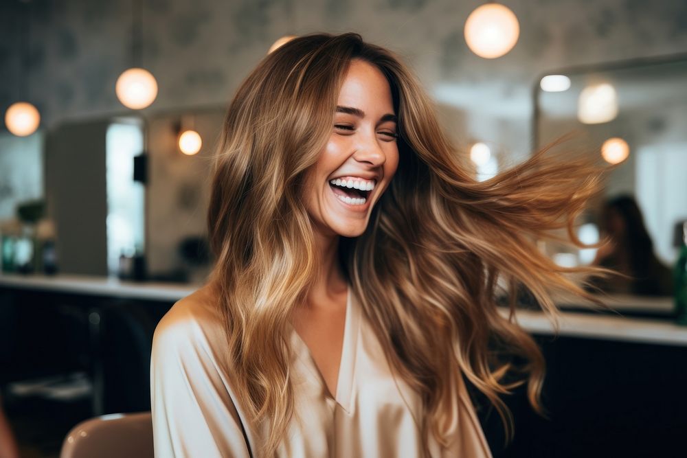 Hairdresser blow drying hair laughing smile adult.