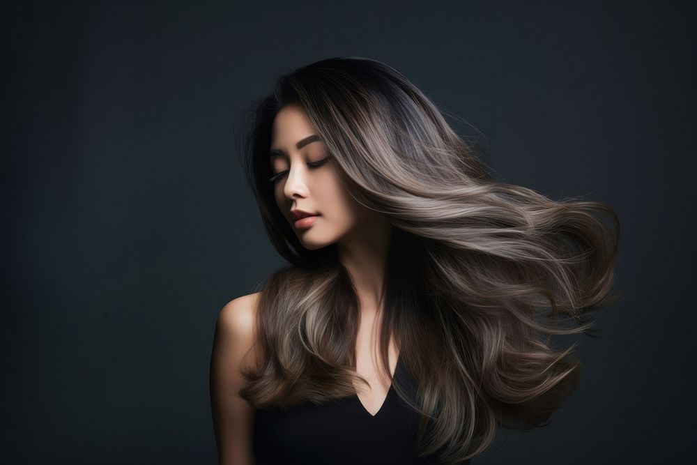 Hairdresser styling balayage hair portrait adult woman.