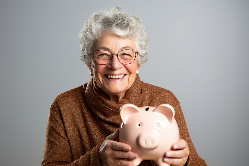 Girl holding his piggy bank adult happy photo.