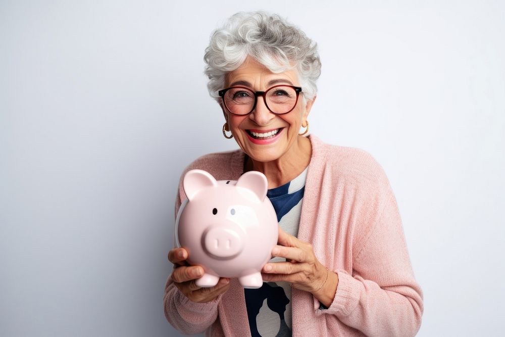 Woman holding his piggy bank glasses happy representation.