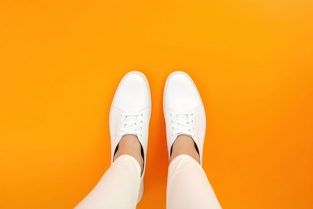 White woman shoes footwear orange color clothing.