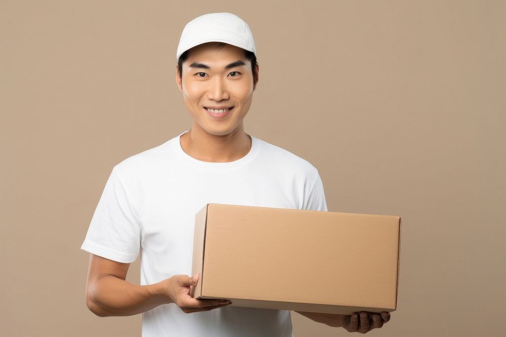 Japanese delivery man holding blank white box cardboard portrait delivering.