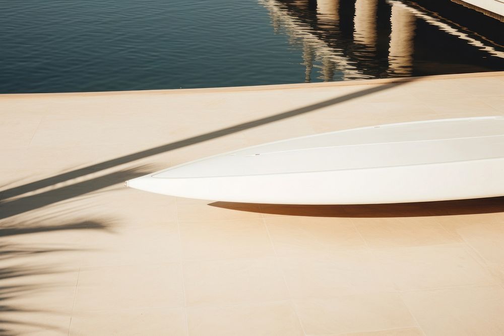 White surfboard outdoors floor day.