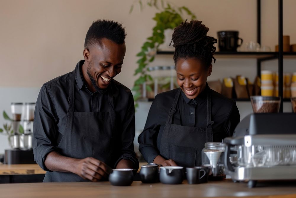 Black male and female staff In Coffee Shop coffee adult happy.