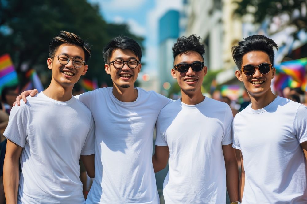 South east asian men standing smiling portrait glasses t-shirt.