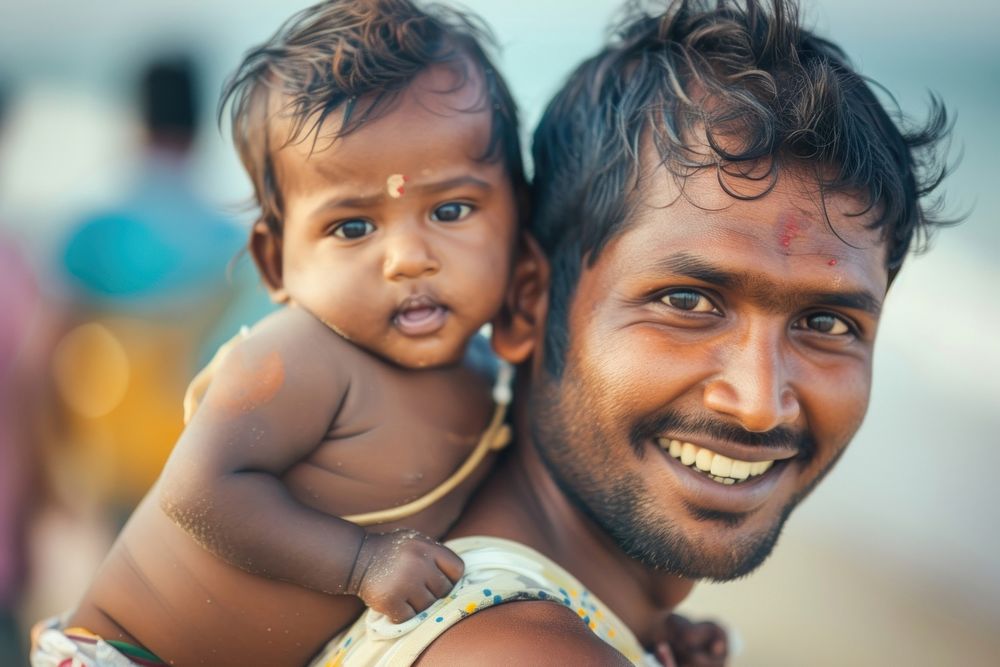 Indian dadpiggyback baby on a beach photography portrait family.