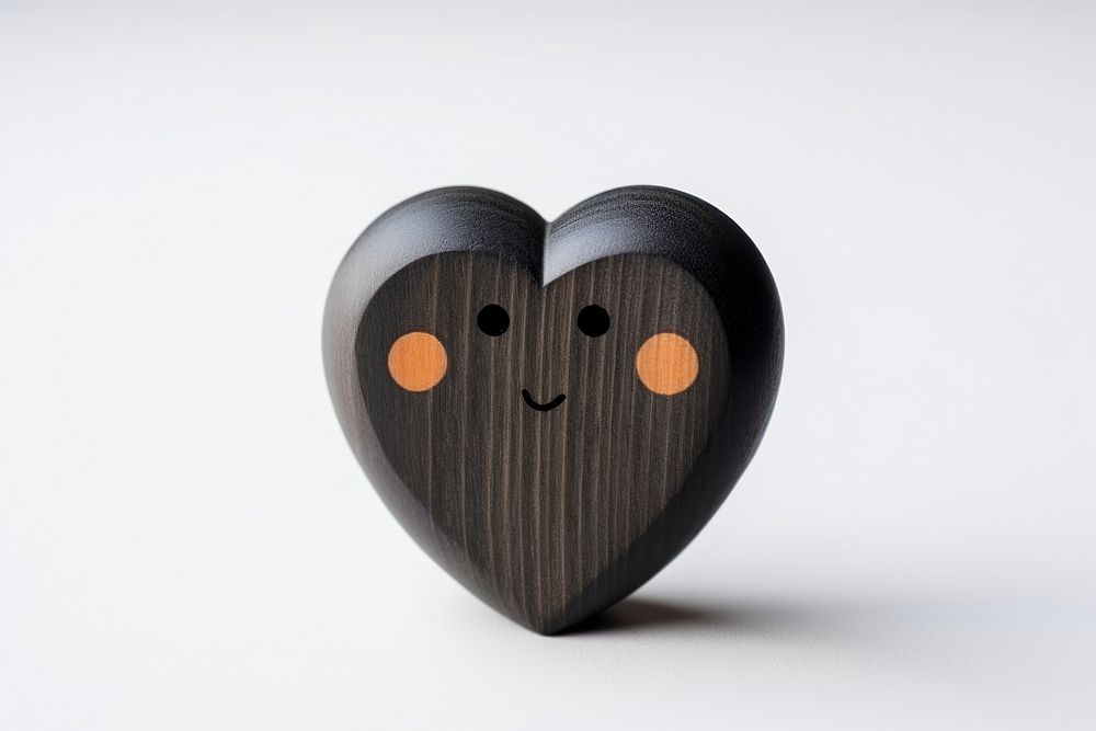 Cute black heart wood toy anthropomorphic.
