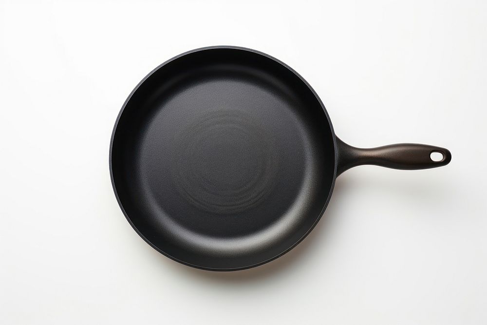Black fry pan wok white background simplicity.
