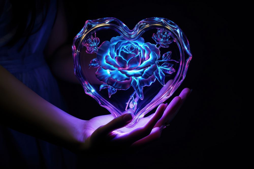 Neon heart and rose in hand light adult illuminated.