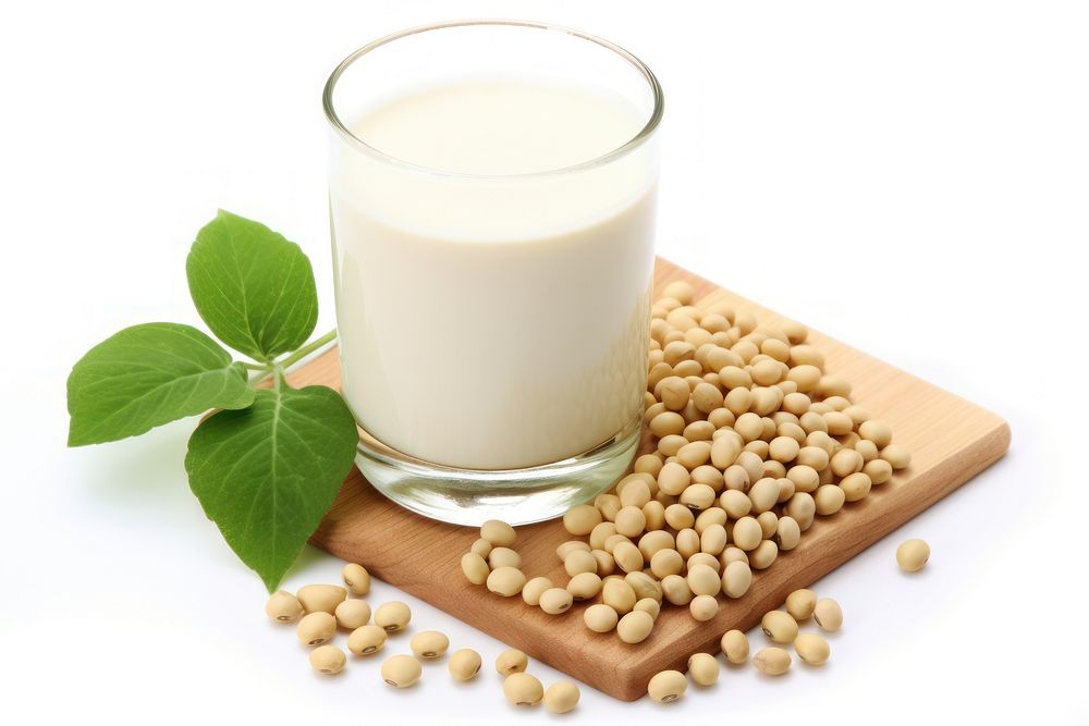 Soymilk withe soybeans plant food white background.