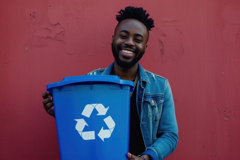 Man holding recycle bin container recycling happiness.