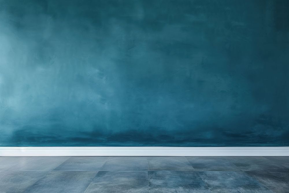 Blue wall texture backgrounds blackboard flooring.