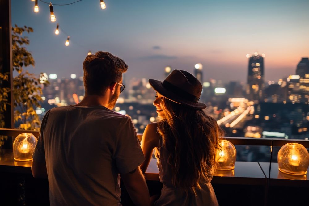 Couple enjoying on a rooftop bar adult togetherness architecture.
