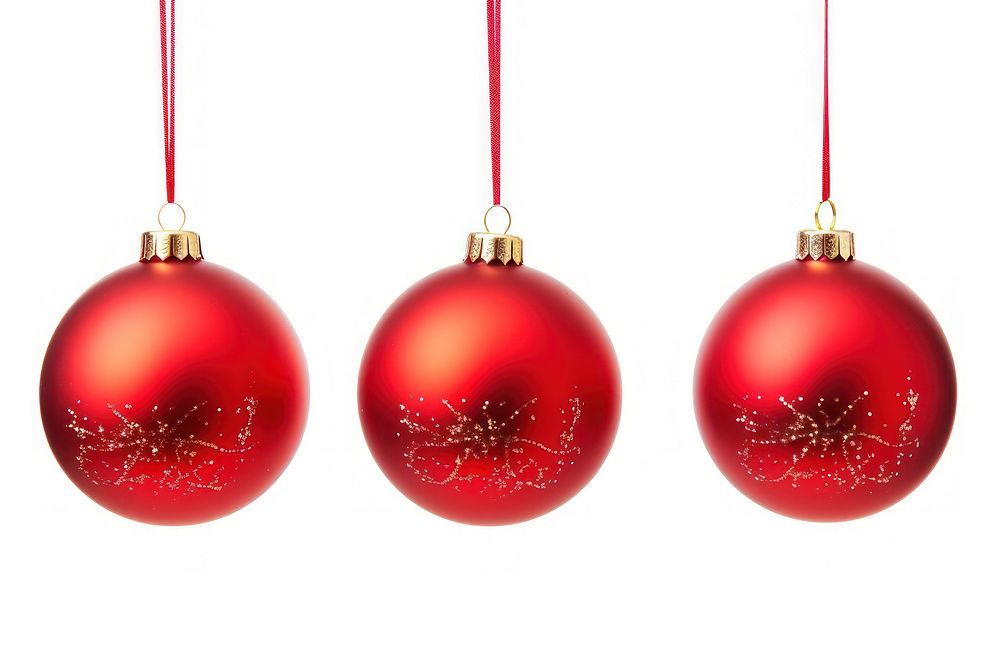 Red Christmas baubles hanging from red ribbon christmas white background illuminated.