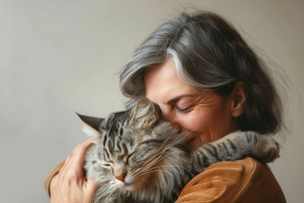 Person hugging a pet portrait animal mammal.
