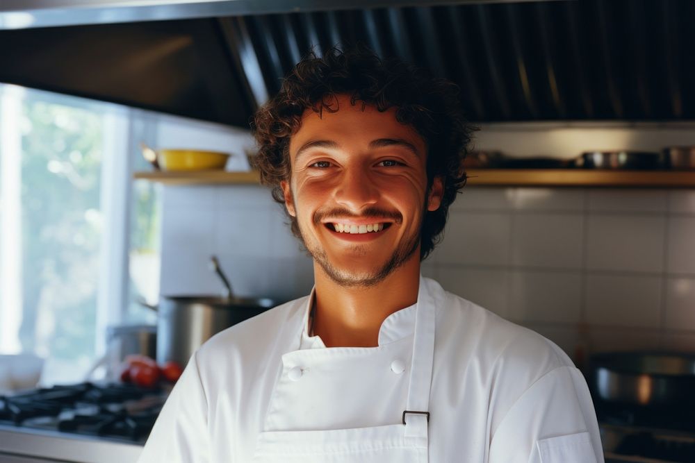 Male chef smilling in the kitchen adult smile men.