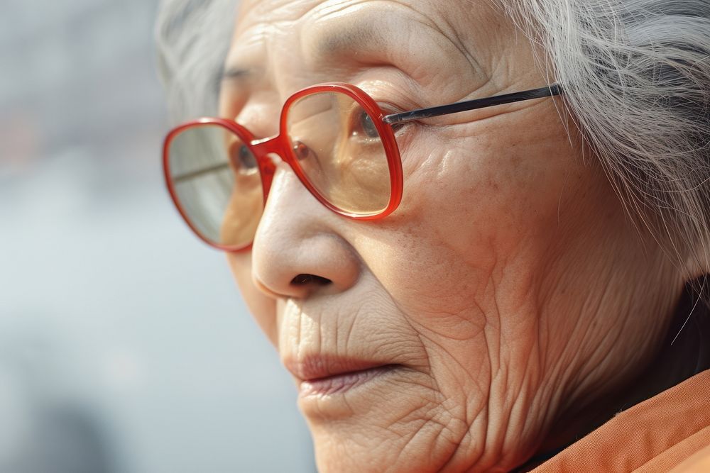 Asian old woman glasses adult contemplation.