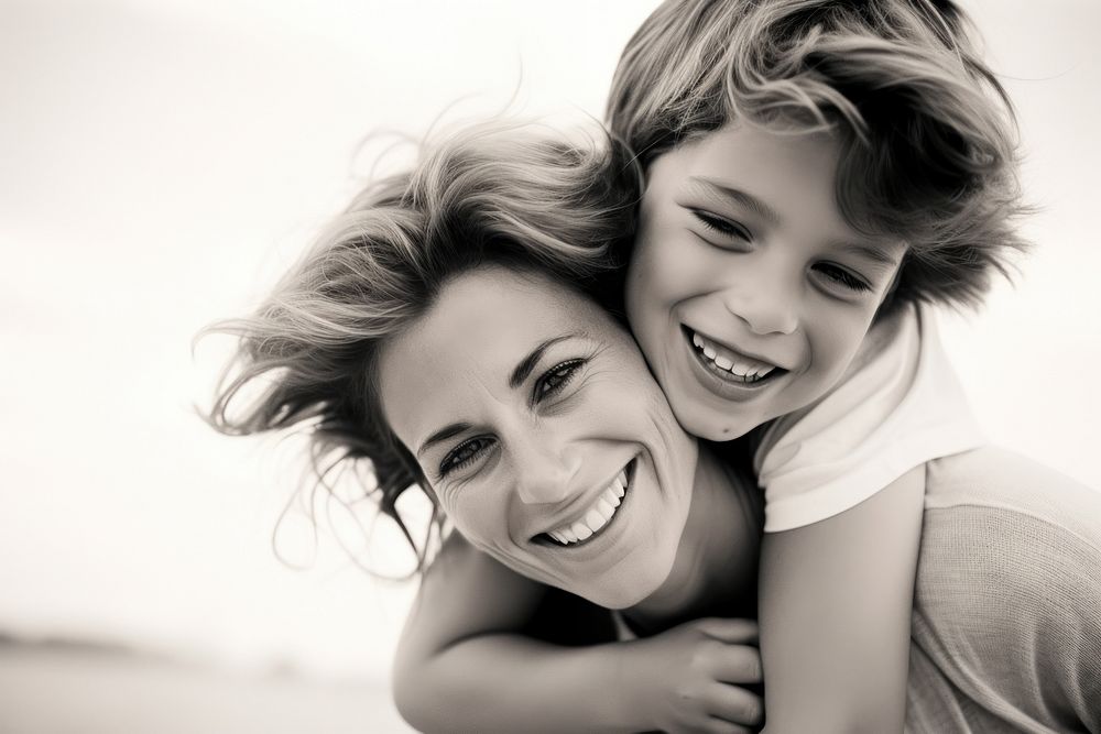 Mother and son smile laughing portrait.
