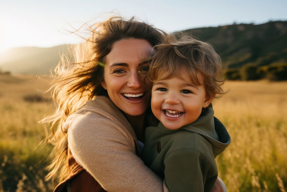 Mother and toddler smile laughing portrait.