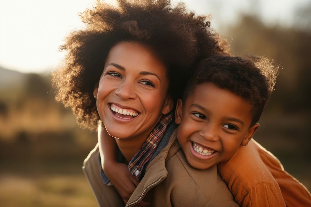 African American mother and son smile laughing portrait.