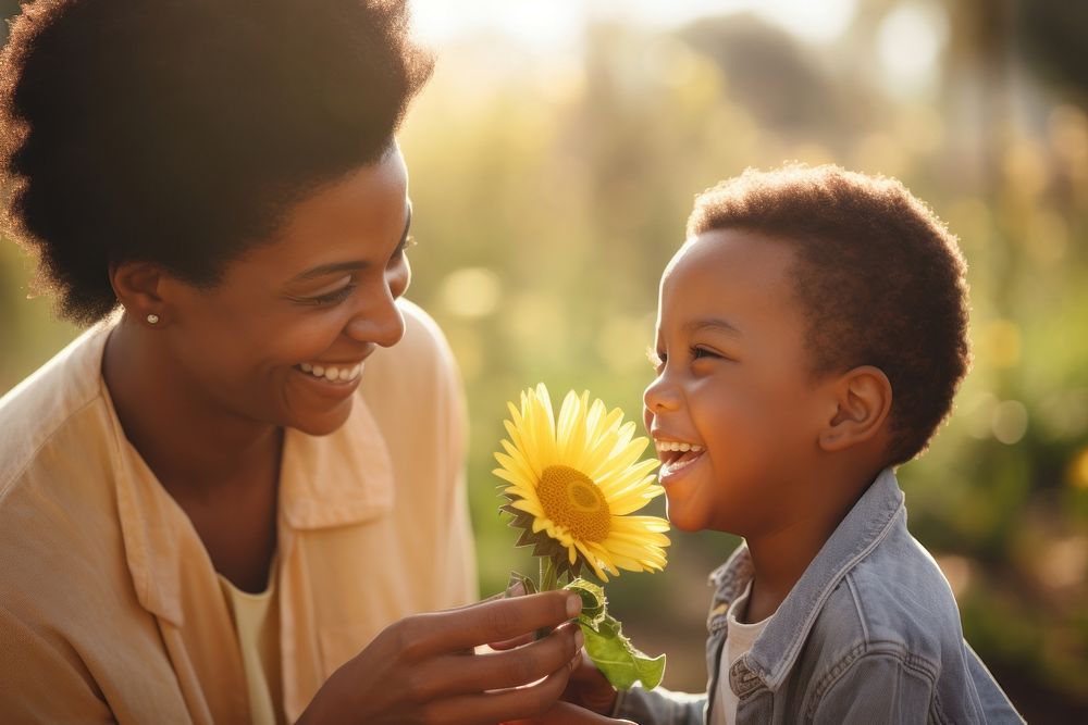 Son giving flower to mother child adult smile.