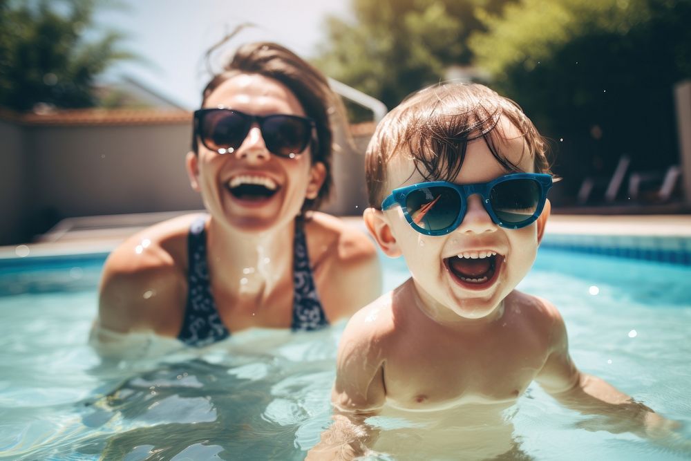 Mother and toddler sunglasses swimming portrait.