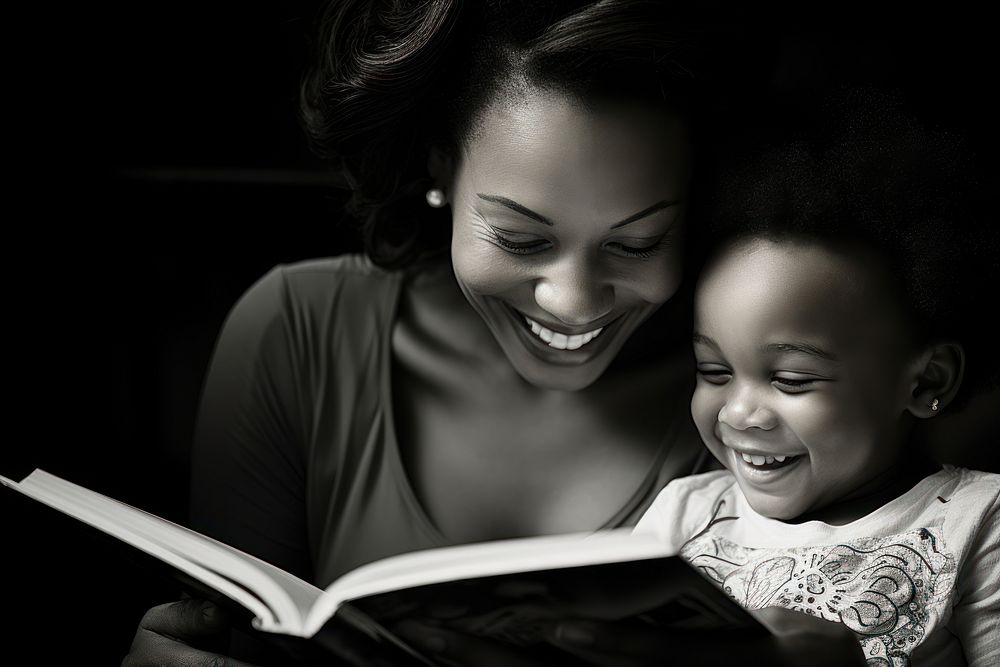 Mother and toddler reading book publication.