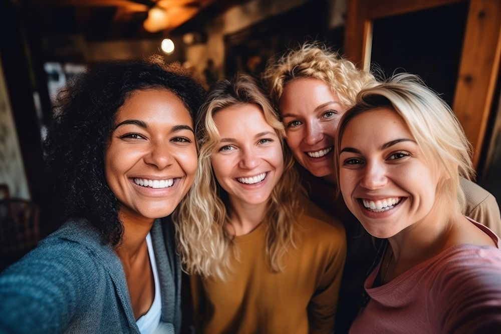 Women friends laughing portrait headshot.