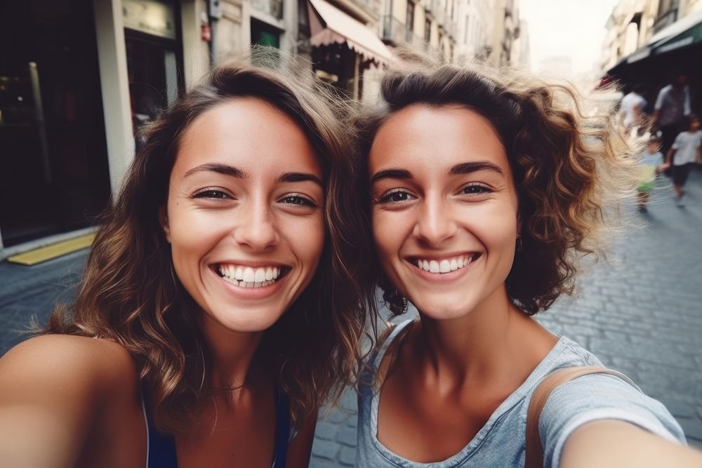 Women friends portrait selfie laughing.