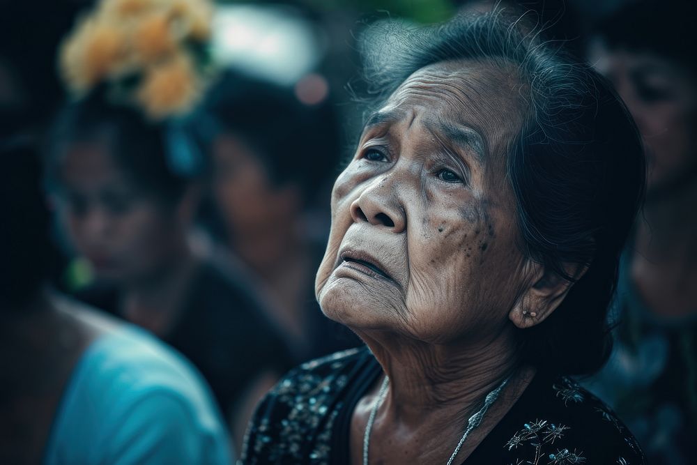 Thai people crying at the Thai grave adult sad contemplation.