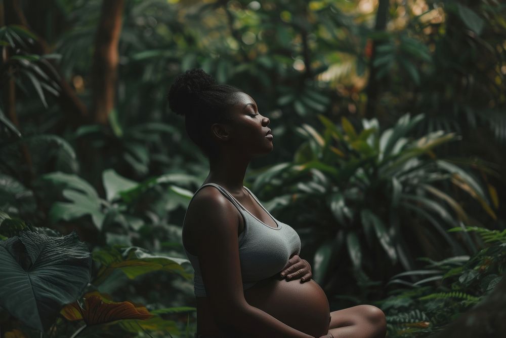 Black woman pregnant sitting plant adult.