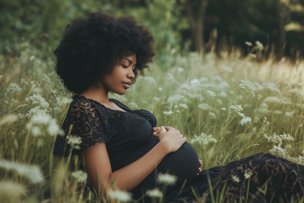 Black woman pregnant adult contemplation anticipation.