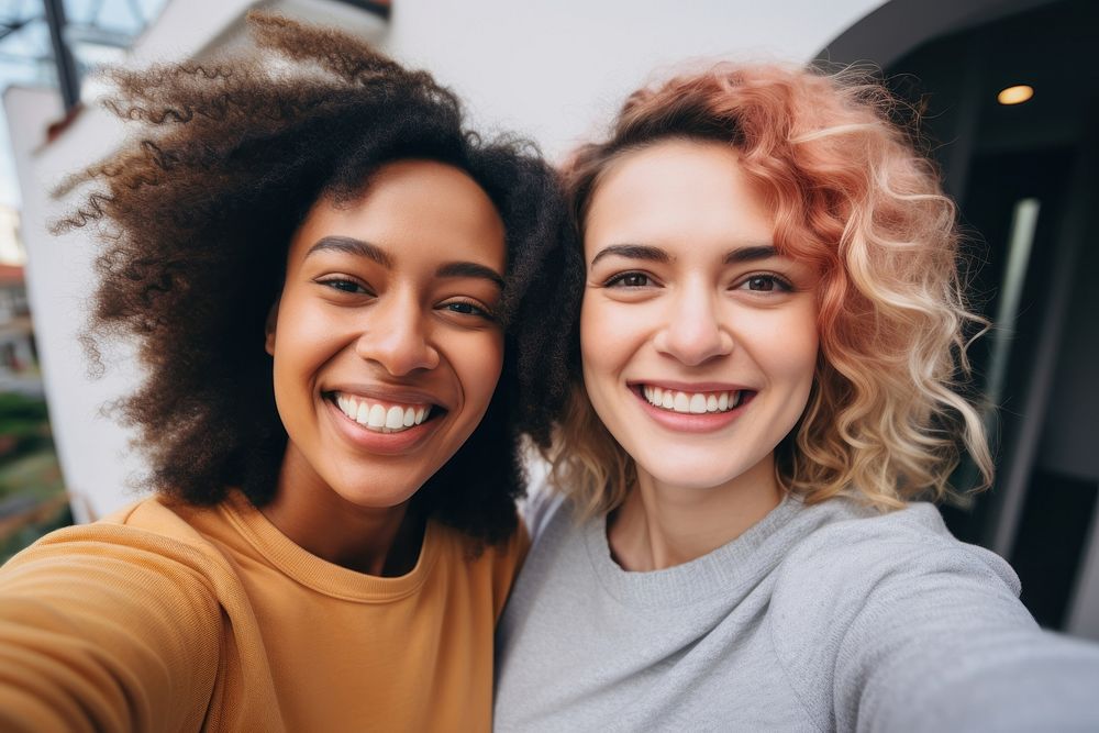2 women friends selfie laughing portrait.