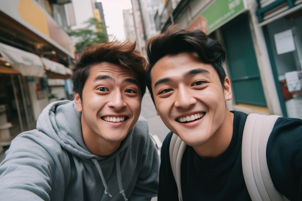 2 men asian friends selfie laughing portrait.