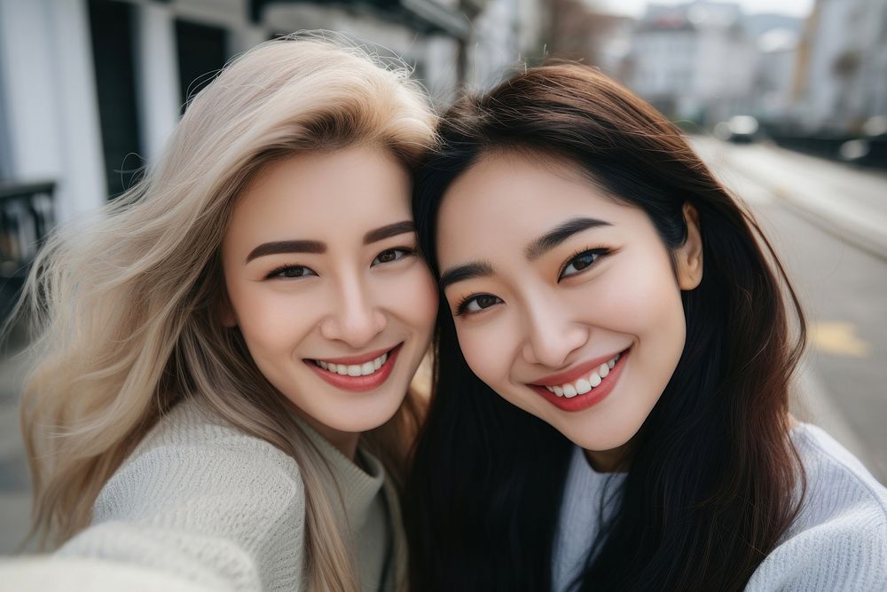 2 women friends laughing portrait headshot.