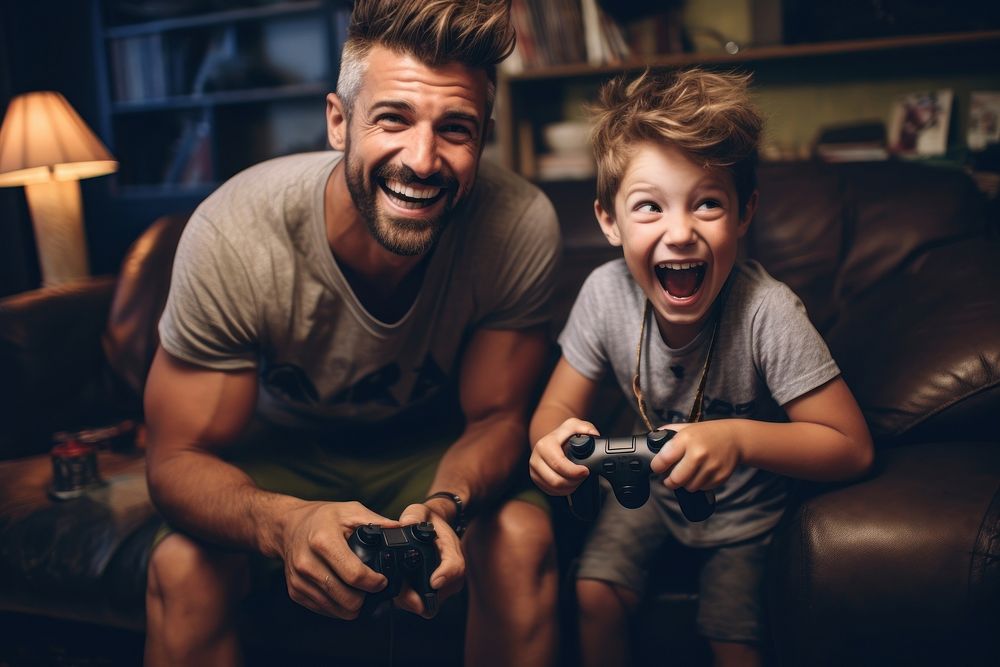 Father playing games with son laughing child adult.