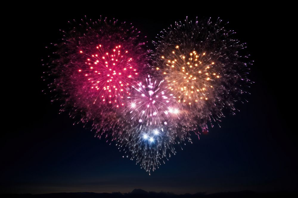 Fireworks colorful heart shape sky illuminated celebration.