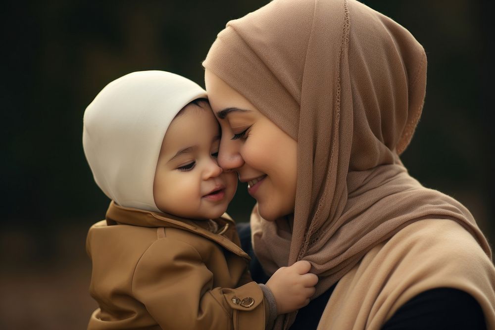 Muslim mother portrait outdoors toddler.