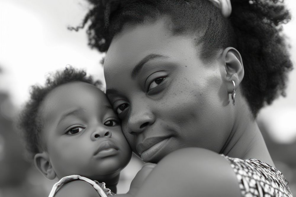 Black mother holding a toddler photography portrait adult.