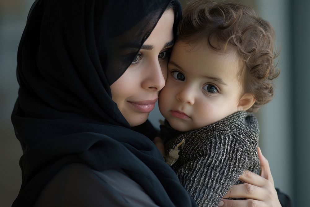 Middle eastern mother holding a toddler photography portrait adult.