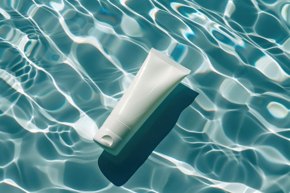 Blank white cream tube sunlight swimming floating.