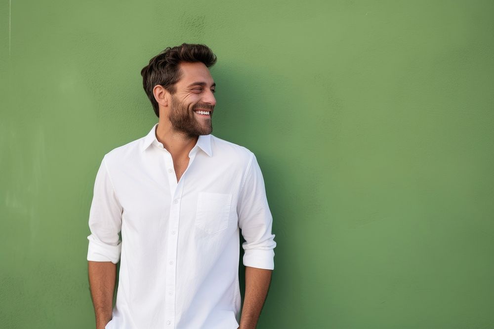 A happy man wearing white t shirt adult smile green.