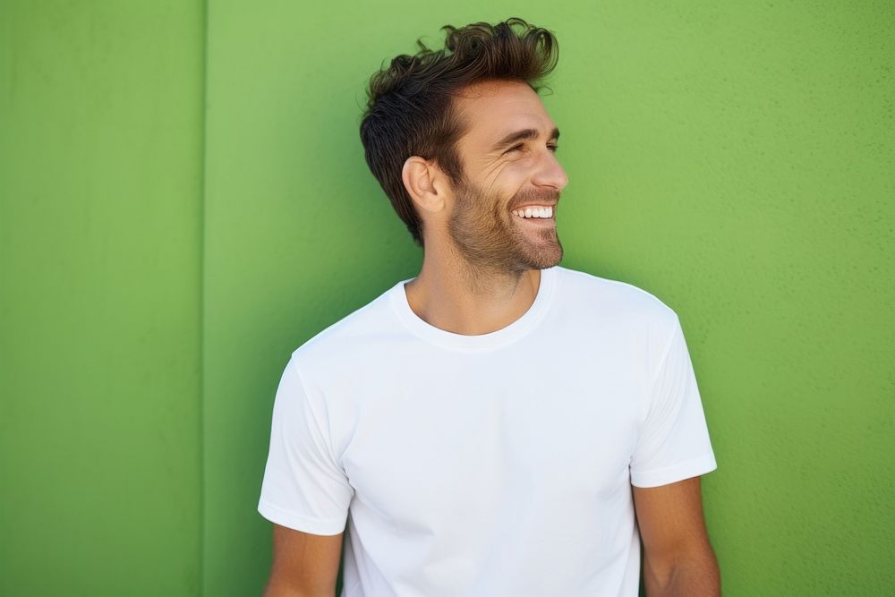A happy man wearing white t shirt t-shirt adult smile.