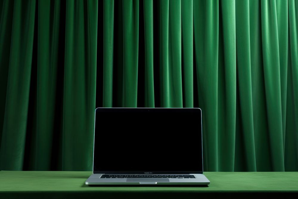 A laptop curtain green computer.