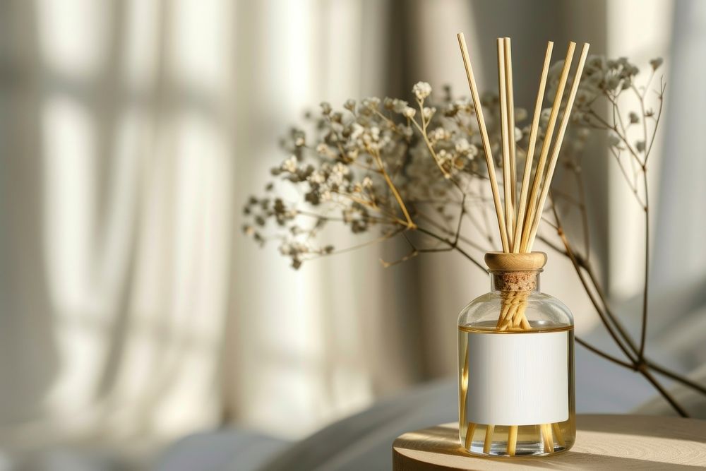 Reed diffuser white windowsill container.