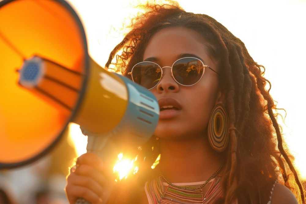 Young african american woman using megaphone portrait glasses adult.