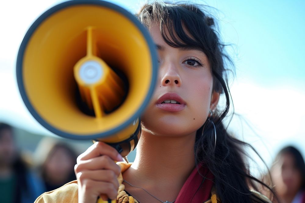 Young latinx woman using megaphone portrait photo girl.
