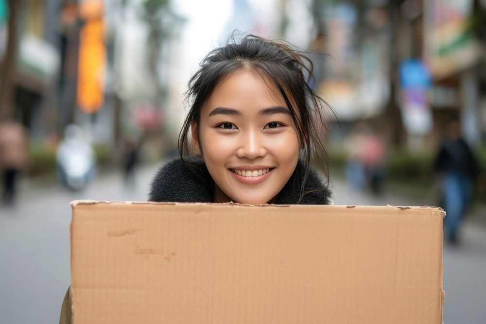 Young asian woman cardboard smile happy.