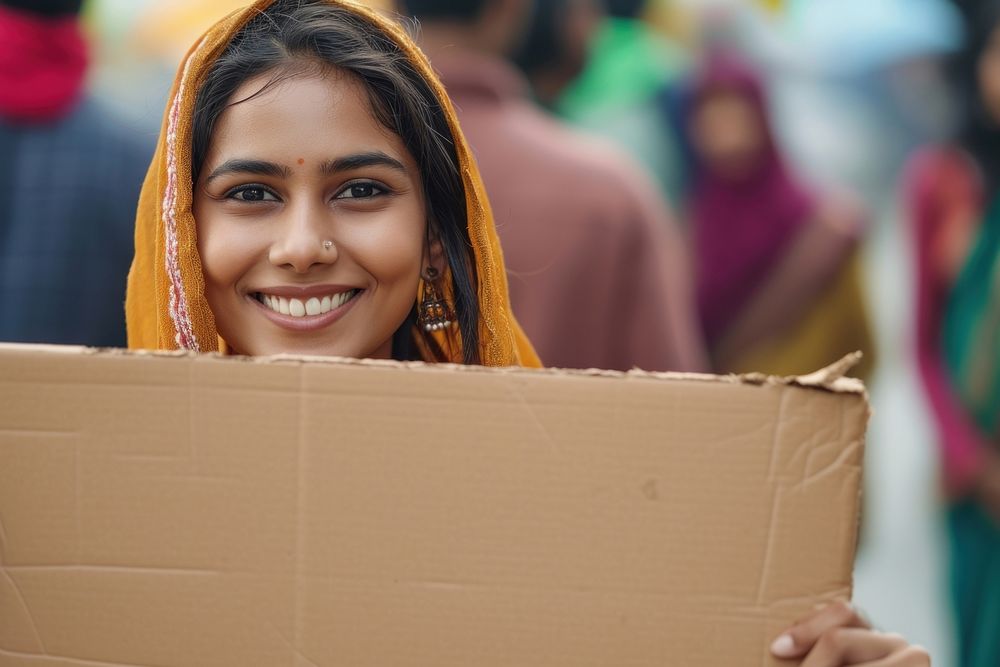 Young indian woman cardboard holding smile.
